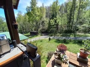 a balcony with a view of a garden at Casa Pucon sector Laguna ancapulli in Pucón