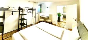 a room with a bed and a mirror at GastRoom Am Seefeld in Grafing