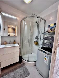 a bathroom with a shower and a sink at Studio Apartment - Domaine du Golf Resort in Roquebrune-sur-Argens