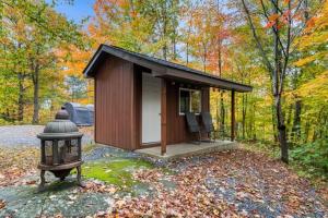 a small cabin in the middle of the woods at 3 bedrooms waterfront Cottage in Parry Sound