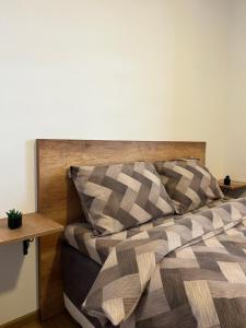 Rúm í herbergi á Apartman Maša