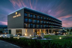 a hotel building with a sign on it at night at Best Western Parkhotel Hagenberg in Hagenberg im Mühlkreis