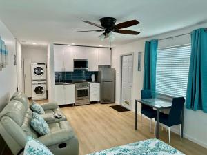 a living room with a couch and a table at Seashell 8 - Seasonal Rental in Boynton Beach