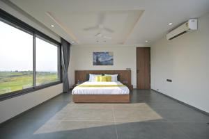 Postel nebo postele na pokoji v ubytování Jalsa Villas Phase 2