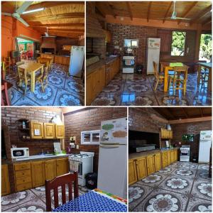 a kitchen with wooden cabinets and a table and refrigerator at Hostel el Amanecer in Puerto Iguazú