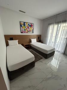 Posteľ alebo postele v izbe v ubytovaní Twin Hotel Tanger