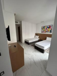 Posteľ alebo postele v izbe v ubytovaní Twin Hotel Tanger