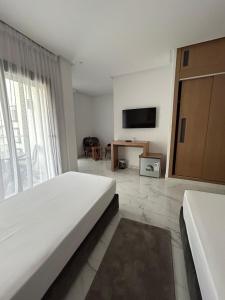 Posteľ alebo postele v izbe v ubytovaní Twin Hotel Tanger