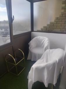 Postel nebo postele na pokoji v ubytování AIK Kula studio