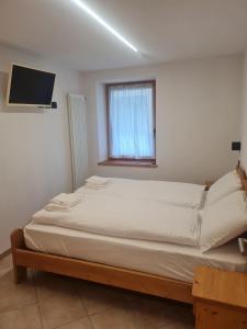 A bed or beds in a room at Casa Le Iscle