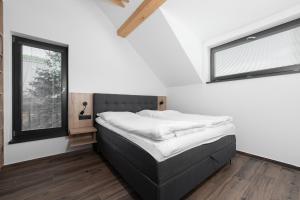 Postel nebo postele na pokoji v ubytování Apartmány HAFERKY Velké Karlovice