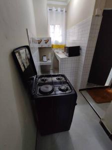 a kitchen with a stove top in a room at consortium apartments in Bungoma