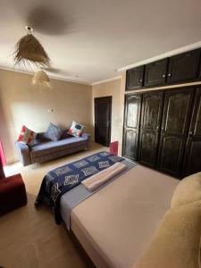 Ein Bett oder Betten in einem Zimmer der Unterkunft ASNFU AUBERGe
