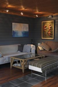 a living room with a couch and a coffee table at 3ART recreation in Tromsø