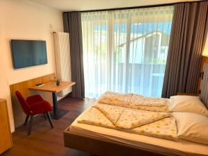 Postel nebo postele na pokoji v ubytování Hotel Tanja-Sonnenhof