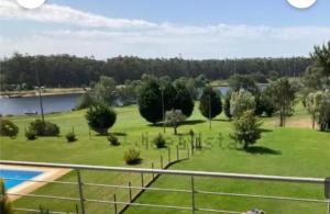 a view of a park with a swimming pool at Quinta da Barca Resort in Gandra