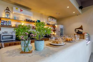 a kitchen with a table with plates of food on it at Bondo Hometel in Cartagena de Indias
