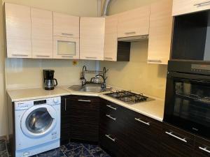 Kuchyň nebo kuchyňský kout v ubytování Apartament w samym centrum!
