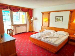 Postel nebo postele na pokoji v ubytování Hotel Tanja-Sonnenhof + 22 fotografií