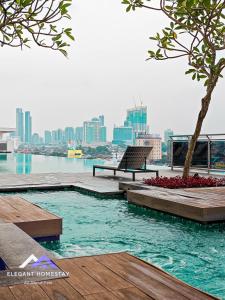 a swimming pool with a view of the city at 1 Tebrau By Elegant Johor Bahru in Johor Bahru