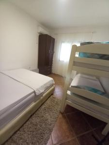 Postel nebo postele na pokoji v ubytování Perovic 23 + 20 fotografií