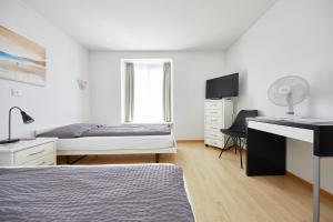 Llit o llits en una habitació de Hotel Rotes Haus