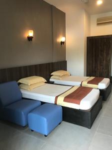 Säng eller sängar i ett rum på Baiduri's Place