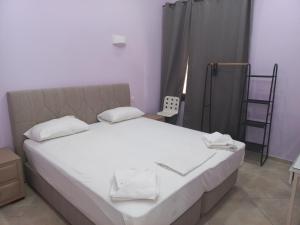 Ένα ή περισσότερα κρεβάτια σε δωμάτιο στο Sappho Hotel 