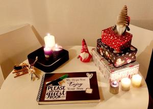 a table with a christmas cake and candles on it at appartement cosy Strasbourg in Strasbourg +3 photos