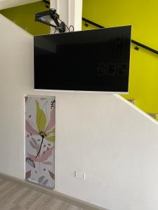 a computer monitor on top of a white desk at Camino al Río in Viedma