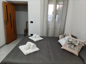 Ένα ή περισσότερα κρεβάτια σε δωμάτιο στο Il Cortile