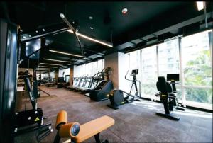 a gym with treadmills and ellipticals in a building at Downtown Miami Hotel in Miami