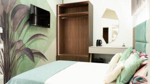 Letto o letti in una camera di Aries Suite Pompei