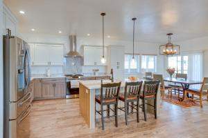 a kitchen and dining room with a table and chairs at Cortez Vacation Rental with Patio and Game Room in Cortez