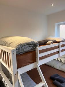a white bunk bed in a room at 1 Bedroom & Bathroom (No kitchen) (Garden) (Driveway) in Dorney