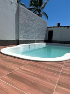 a hot tub on the patio of a house at Hotel Marujo in Morro de São Paulo +35 photos