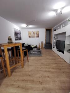 a living room with a couch and a table at Schöne Ferien- oder Monteurwohnung "Ausblick Storchennest" in Schermbeck