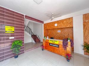 a lobby with a reception desk in a building at Hotel Elite by Agira- Spacious Apartments with Balcony in Yelahanka