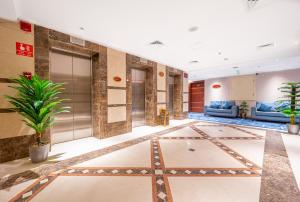 a lobby of a hotel with a star on the floor at Shaza Regency Plaza Al Madinah in Al Madinah