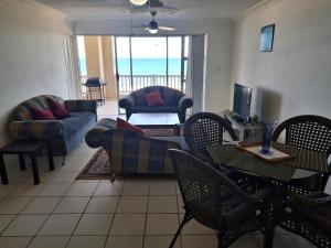 a living room with a couch and chairs and a television at Laguna La Crete B in Margate
