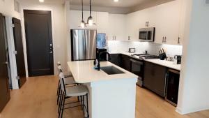 a kitchen with a sink and a counter top at Luxe Mid-Downtown apartment in Houston