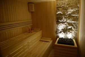 a wooden sauna with a stove in the corner at Berjer Boutique Hotel & Spa in Istanbul