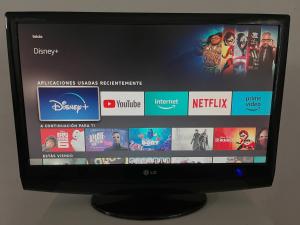 a television screen with a bunch of movies on it at Alicante Garden & BBQ - Estudio adosado con Jardín, Parking Privado y Relax Total in Alicante