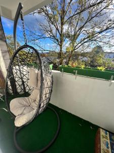 a swing on the back porch of a house at Schlafzimmer der Stille in Bochum