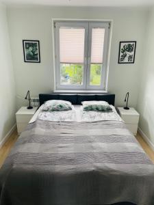 Llit o llits en una habitació de Apartament Sunny Home