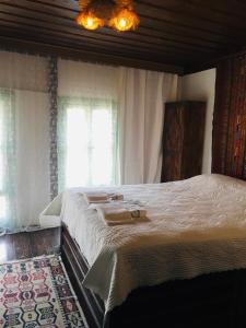 En eller flere senge i et værelse på Şirince leylak ev pansiyon