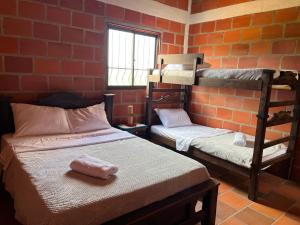 Postel nebo postele na pokoji v ubytování Cabaña Villa Lucia + 4 fotografie