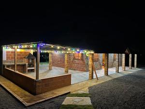 a pavilion with lights on it at night at Cabaña Villa Lucia in San Gil