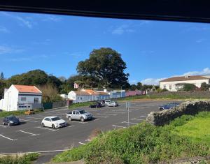 a parking lot with cars parked in it at Urban 44 Guest House in Ponta Delgada