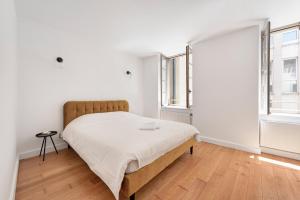 Giường trong phòng chung tại Les Colonnes - T3 - Bastide